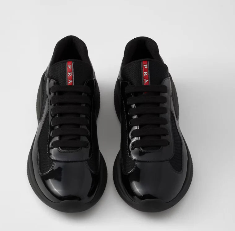 Sneakers Prada America’s Cup en cuir verni et tissu technique